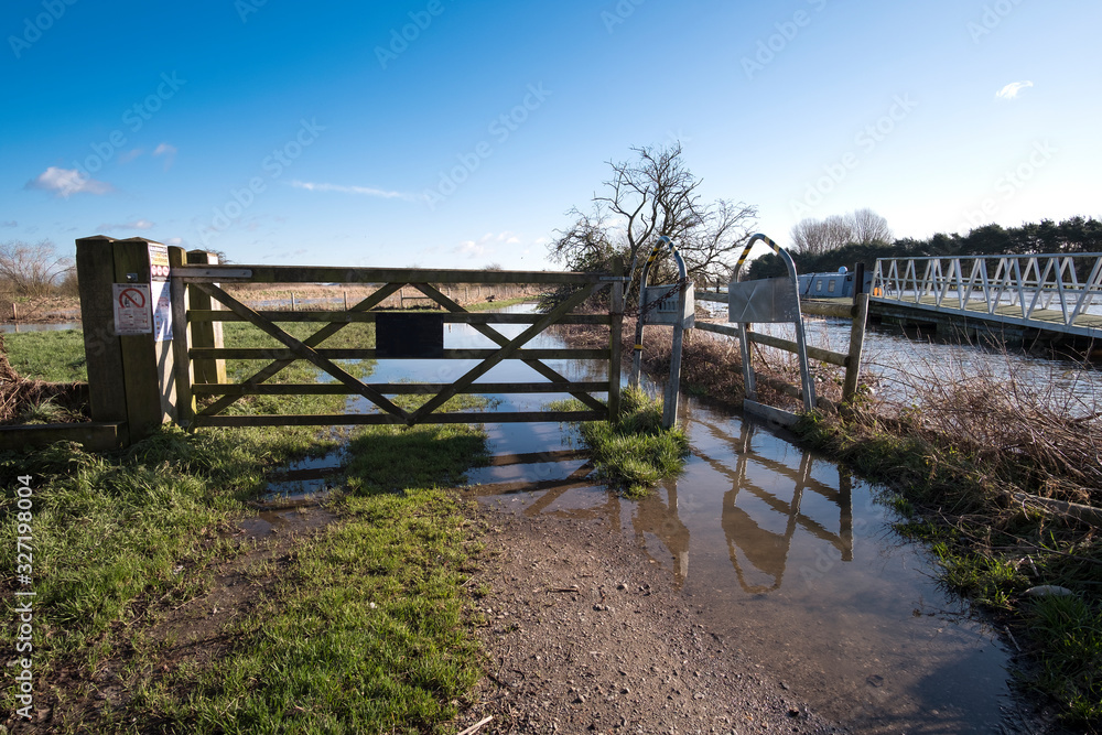Flooded river bank footpath 