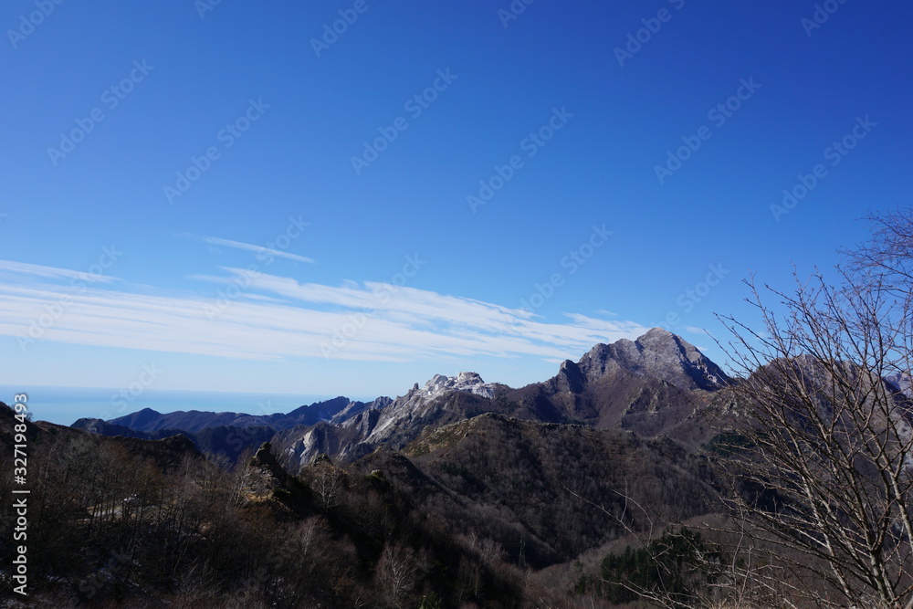 View of the Apuan Alps with a peak cut due to the extraction of white marble