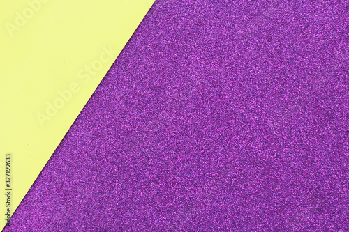 .Abstract background and texture of yellow and purple gliter paper. space for text..