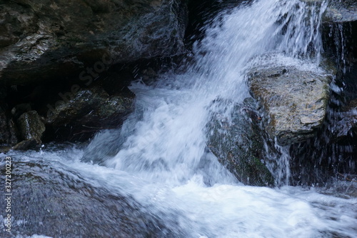 Water flows into a mountain river