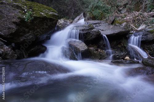 Fototapeta Naklejka Na Ścianę i Meble -  Water flows into a mountain river