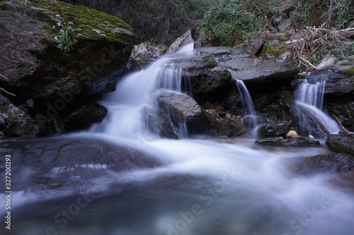 Water flows into a mountain river