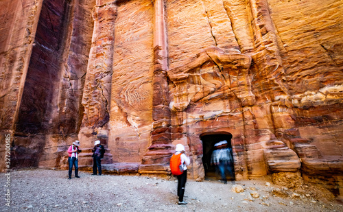 Entrance of underground ancient rock carving, royal tomb in Petra, Jordan.