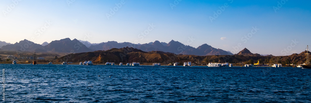 Beautiful panoramic Mountain coastline and harbour with ships