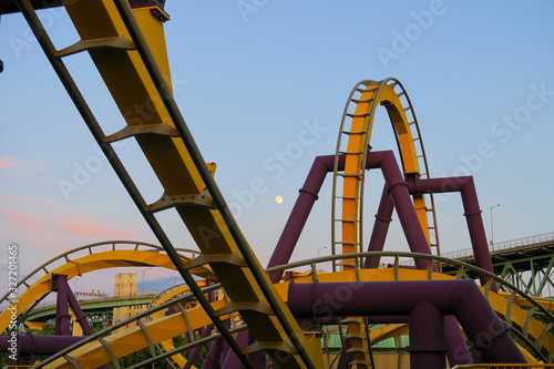 sunset over the old rollercoaster of the entertainment park