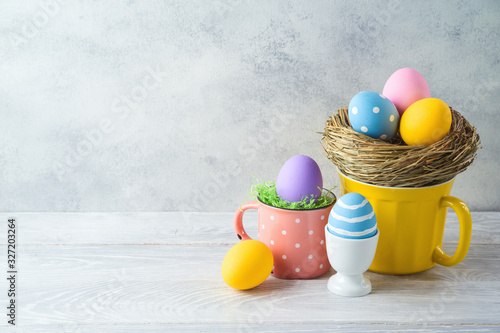 Canvas Print Easter holiday decorations with easter eggs on wooden table