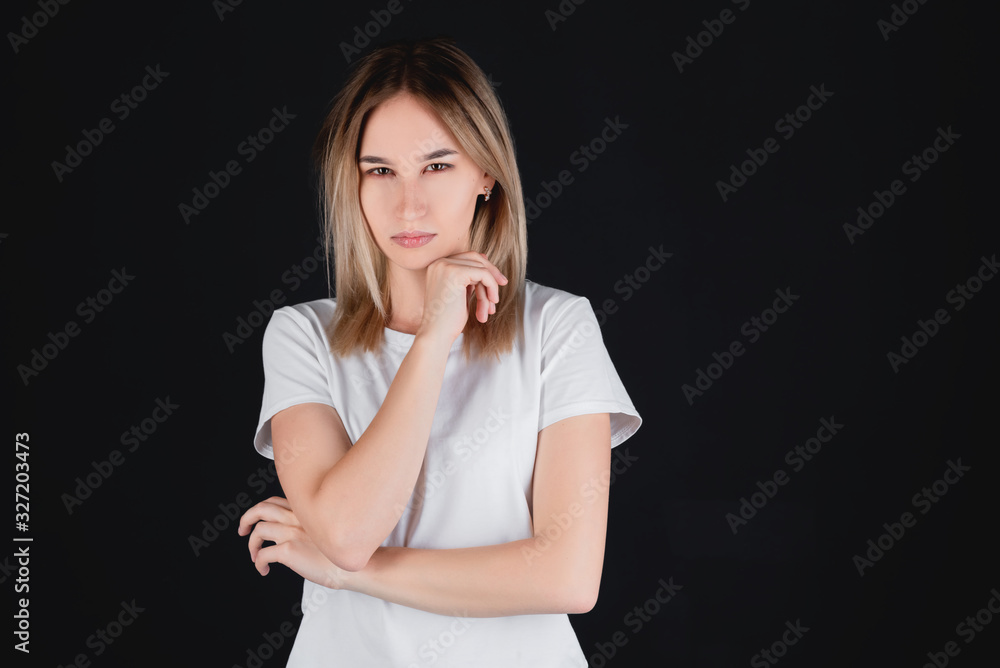 Closeup portrait of a beautiful girl, on an black background. Human face expression, emotions, feeling attitude reaction Closeup portrait of a beautiful girl, on an black background. Human face expression, emotions, feeling attitude reaction