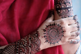 close up of hena decorative on hand women