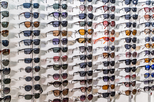 Sales rack of sunglasses. A colorful display of sunglasses for sale