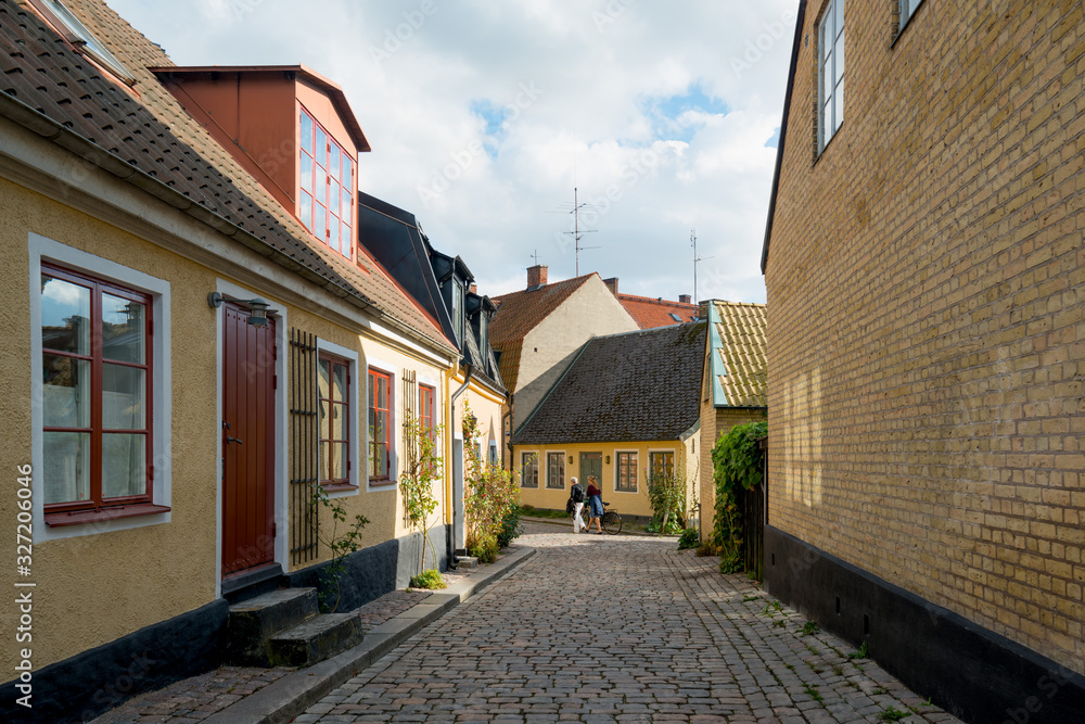 University town Lund, southern Sweden. Colorful houses in cobblestone street in the city center.