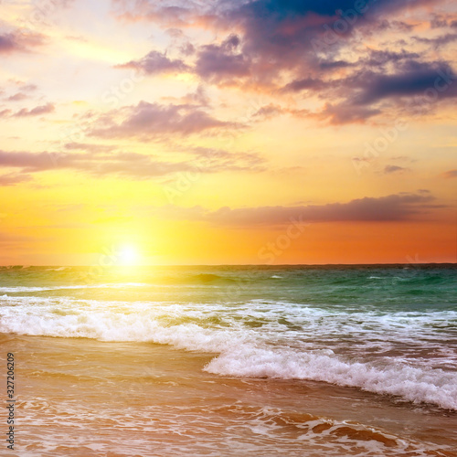 Bilde på lerret Bright sunrise over the sea. The concept is travel.