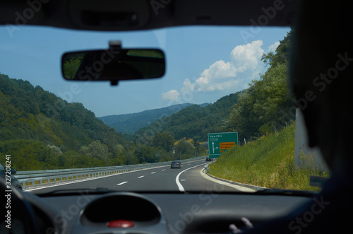 Driving a car on a asphalt highway through a gorge in Serbia