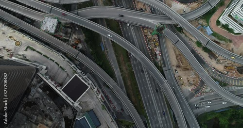 In the air over the streets near Kuala Lumpur. Aerial traffic video of fly overs in Malaysia. Drone time lapse of highway intersections in Mont Kiara, Selangor, Malaysia. Confusing Sprint Expressway photo