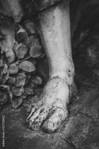 Close up of a foot of a woman statue