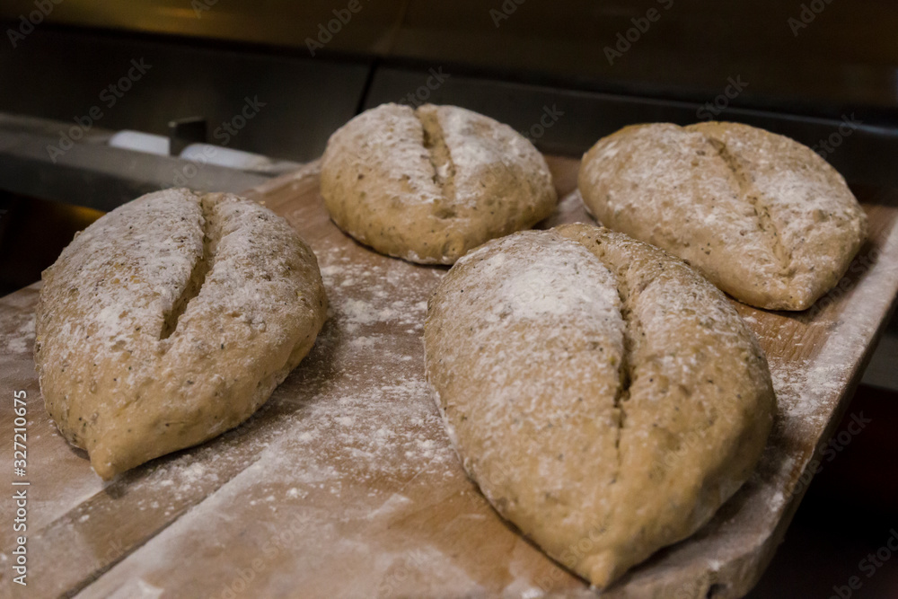 bread loafs ready to get inside the oven bread loafs ready to get inside the oven