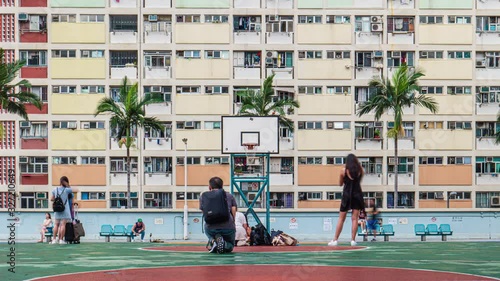 Timelapse of lots of tourist / hipster come to visit and take photos at Choi Hung Estate rainbow colored building for their social media, Hong Kong, July 2019