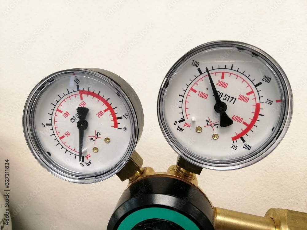 Hydraulic Pressure Gauges. pressure gauge on a gas regulator in a laboratory analytical equipment. Hydraulic Pressure Gauges. pressure gauge on a gas regulator in a laboratory analytical equipment.