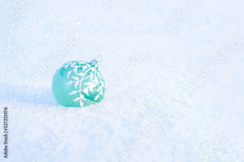 Christmas ball on the snow.