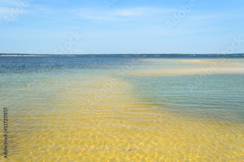 The clean and transparent water of the natural beaches of the Amazon river in Brazil il the middle of the forest