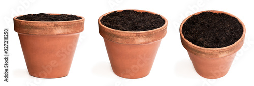 Set of old ceramic flower pot with soil isolated on white photo