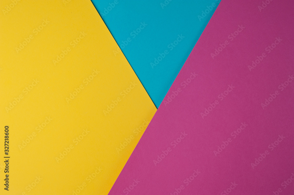 Abstract multi colored paper background - yellow, blue, pink colors