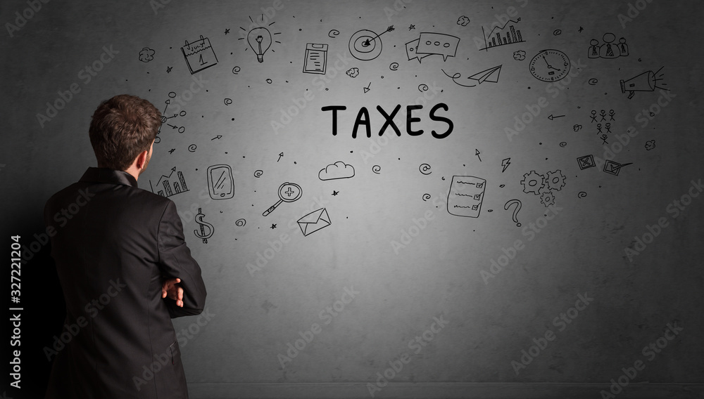 businessman drawing a creative idea sketch with TAXES inscription, business strategy concept businessman drawing a creative idea sketch with TAXES inscription, business strategy concept