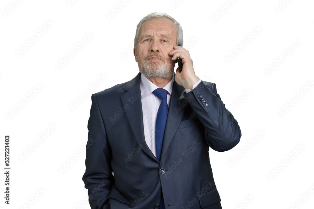 Portrait of old businessman talking on phone. Fashionable blue business suit with tie. White isolated background. Portrait of old businessman talking on phone. Fashionable blue business suit with tie. White isolated background.