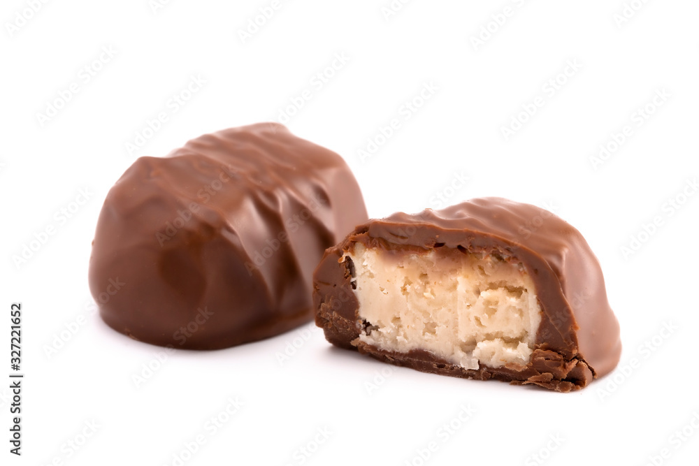 A Chocolate Coconut Truffle Cut Open and on a White Background A Chocolate Coconut Truffle Cut Open and on a White Background