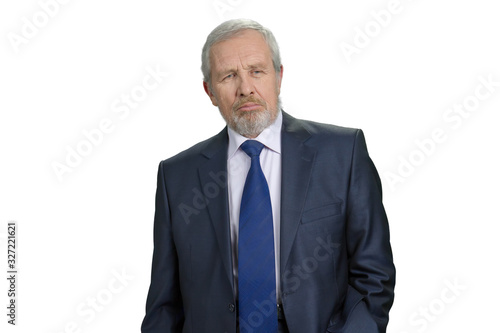 Serious pensive old businessman. Fancy suit with tie. White isolated background.