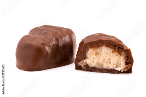 A Chocolate Coconut Truffle Cut Open and on a White Background