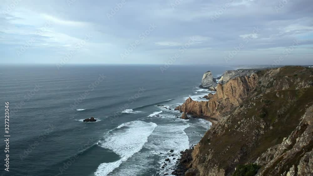 View of Atlantic ocean, waves crash on cliff shore, Portugal View of Atlantic ocean, waves crash on cliff shore, Portugal