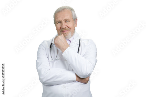 Old pensive doctor portrait. Physician in white uniform. Cutout, isolated background.