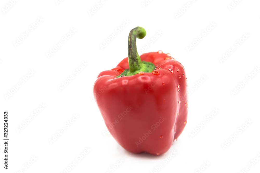 Ripe fresh organic bell peppers in dew drops isolated on a white background. Ripe fresh organic bell peppers in dew drops isolated on a white background.