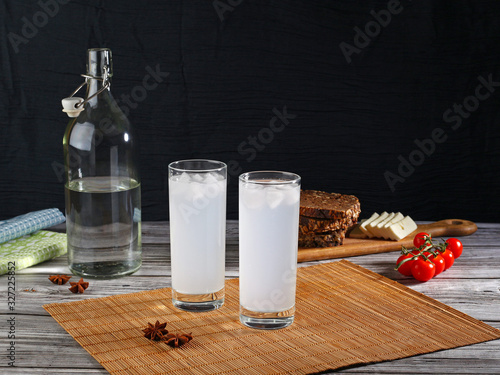 Traditional greek ouzo in two glasses photo