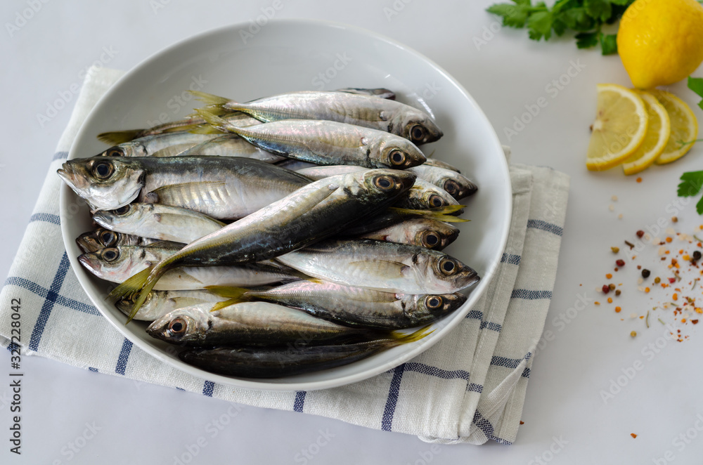 Delicious fresh fish , aromatic herbs, spices and lemon Delicious fresh fish , aromatic herbs, spices and lemon