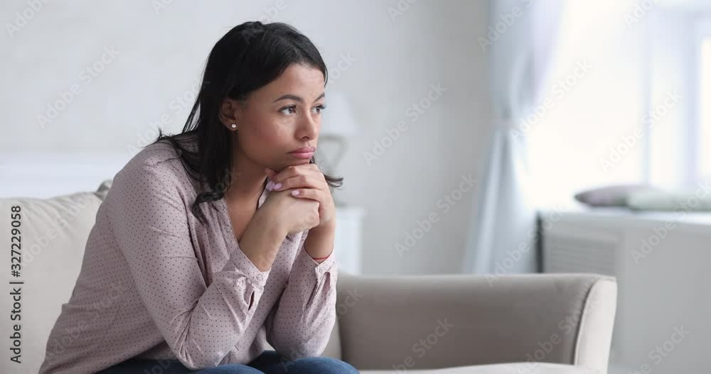 Sad thoughtful young african woman thinking of problems sit alone Sad thoughtful young african woman thinking of problems sit alone