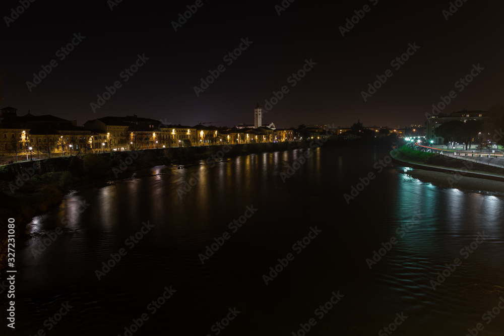 View of Verona and the Adige river from the Castelvecchio bridge, also known as the Scaliger bridge at night
