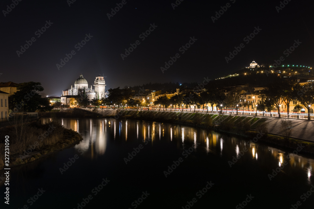 View of Verona and the Adige river from the Castelvecchio bridge, also known as the Scaliger bridge at night