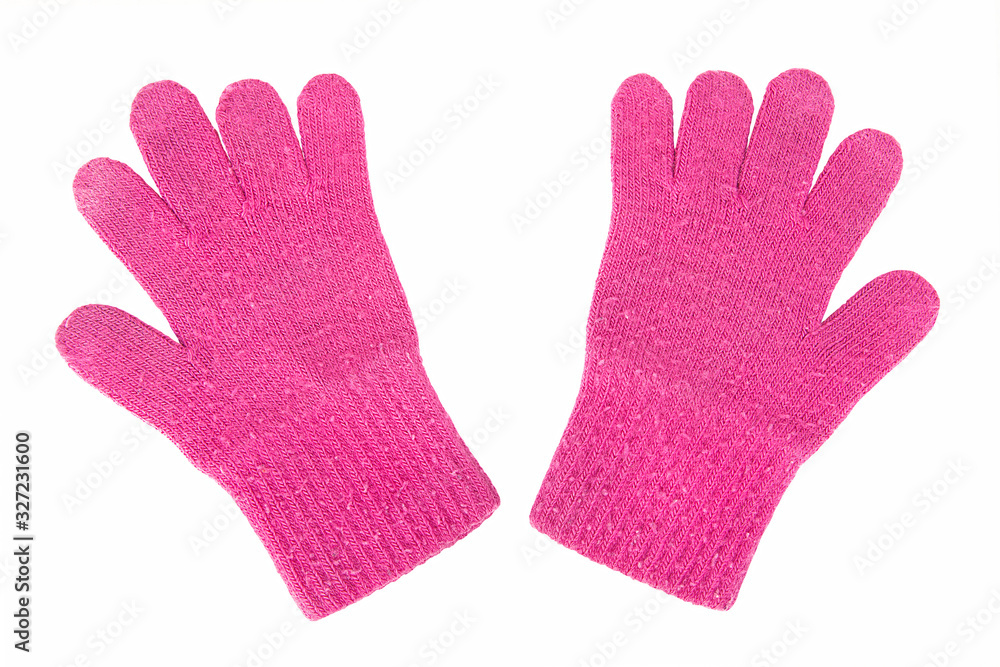 Childish woolen gloves. Isolated on white background with clipping path. Pair of children's knitted pink female gloxe on white bg. Top view. Overhead shot. Studio photography. Bitmap image.