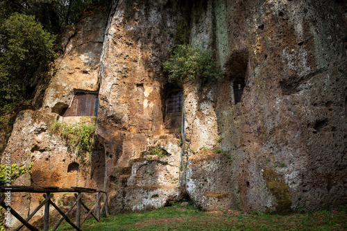 Fototapeta Naklejka Na Ścianę i Meble -  Outside of the Mitreo (Madonna del Parto church) dug out of tuff rock in Sutri, province of Viterbo, Lazio, Italy