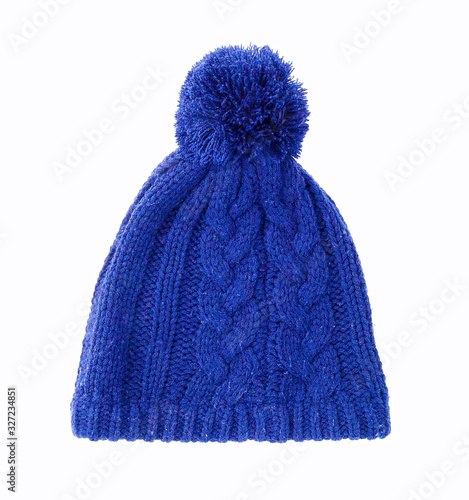 Pom Pom Knitted Winter Classic Hat for ladies. Isolated on white background. With clipping path. Blue bobble hat. Cap with yarn bobble on the top. Blue knit coif for cold weather. Trendy beanie hat.