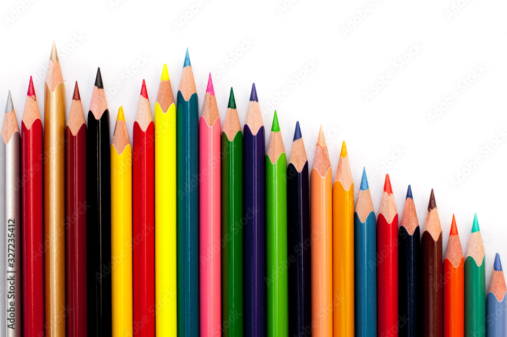 color pencils on a white background in a row, creativity concept color pencils on a white background in a row, creativity concept