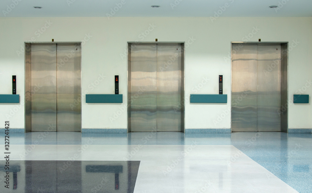 Front View of Three Doors in Elevator with Closed Doors