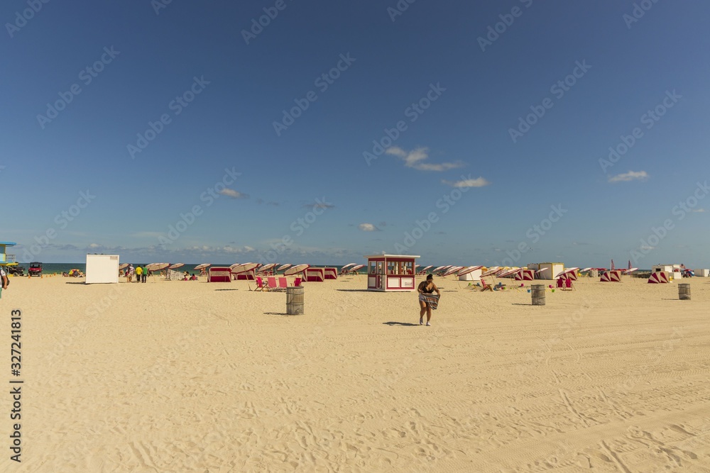 Beautiful landscape view of Miami South Beach coast line. Sand beach, Atlantic Ocean, people on blue sky background. USA. Miami Beach. Beautiful landscape view of Miami South Beach coast line. Sand beach, Atlantic Ocean, people on blue sky background. USA. Miami Beach.