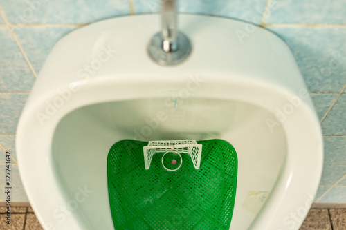 Urinal bowl with soccer / football shoot goal