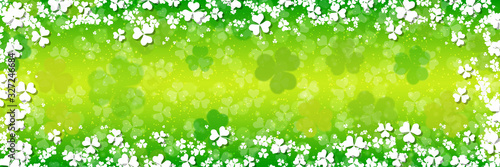 St.Patrick's Day green vector banner with clover leaves and light effects