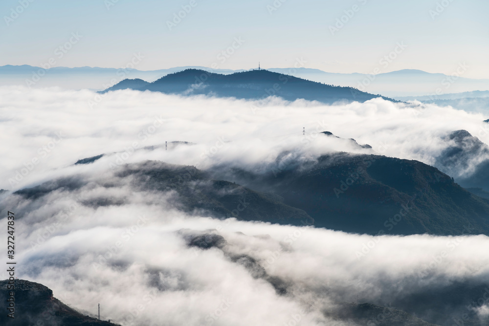 Fototapeta premium Relaxing image of a foggy morning landscape in the mountains