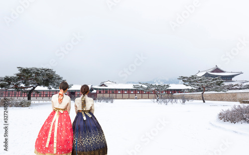 Gyeongbokgung Palace in Winter with Korean national dress Seoul South Korea