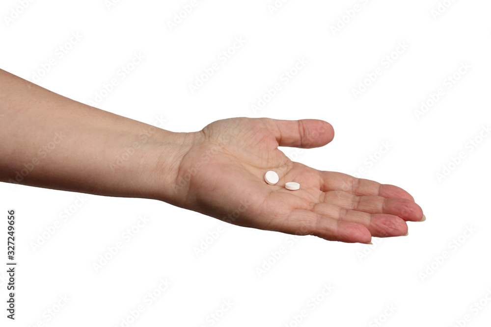 woman holds out her hand with two white pills on a white background, concept of health insurance, medical care, assistance, isolate, copy space