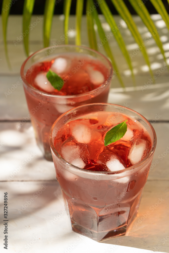 Hibiscus tea also called Jamaica water on white table Hibiscus tea also called Jamaica water on white table